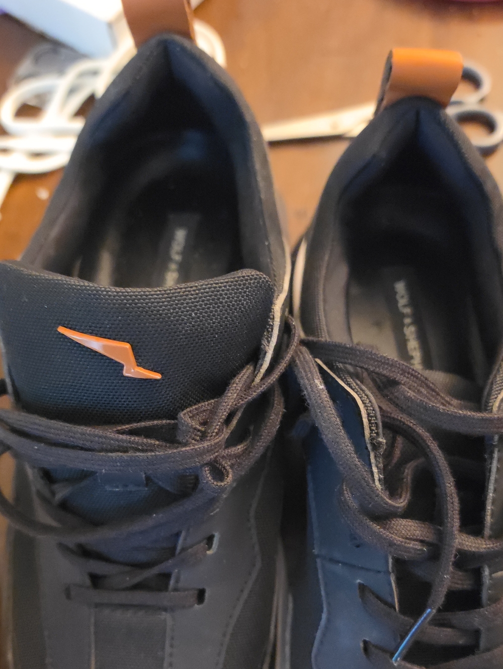 Men's Black Athletic Shoes with Orange Accent Slip-On Tab